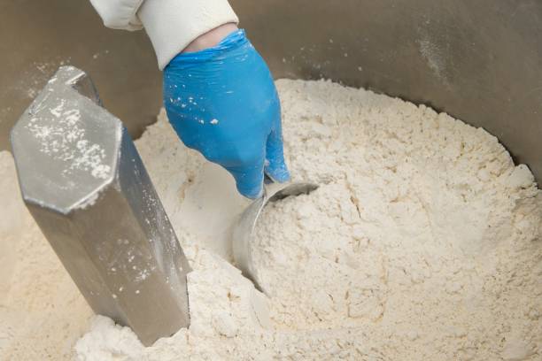 istock Filling white material in a plastic bag and weighting it. 2201018068