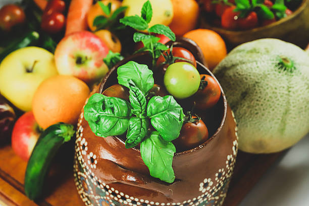 rustic composition of mixed fruits and vegetables viewed from above
