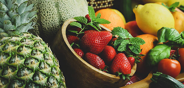 istock rustic composition of mixed fruits and vegetables viewed from above 2201022165