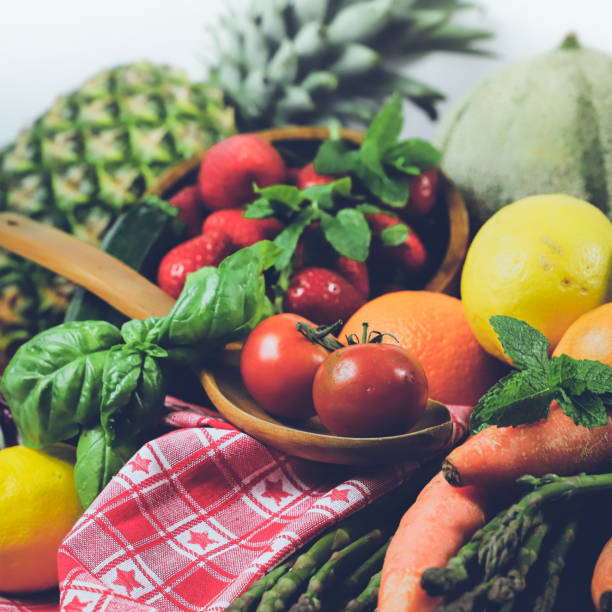 rustic composition of mixed fruits and vegetables viewed from above