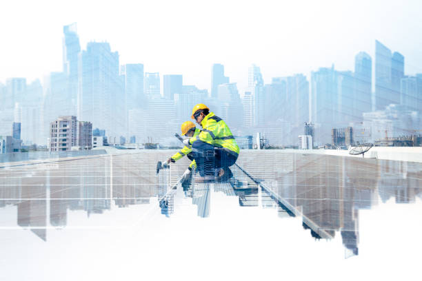 The double exposure image of the engineer thinking overlays with cityscape image with copy space. The concept of engineering, construction, futuristic and industry.