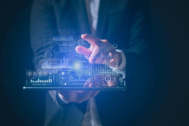 istock Businessman checking diagram or stock market data Big data technology and data science in concept of data analysis. Data scientist querying, analysing and visualizing complex set on virtual screen 2201027699