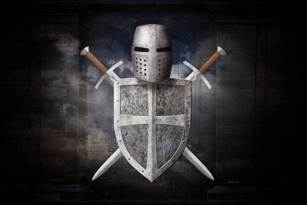 istock knight's helmet shield and two swords on stone wall background 2201029390