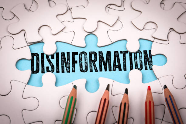 istock DISINFORMATION. White puzzle pieces and colored pencils 2201030075