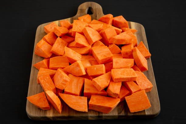 istock Raw Chopped Sweet Potatoes on a Cutting Board, low angle view. 2201033667
