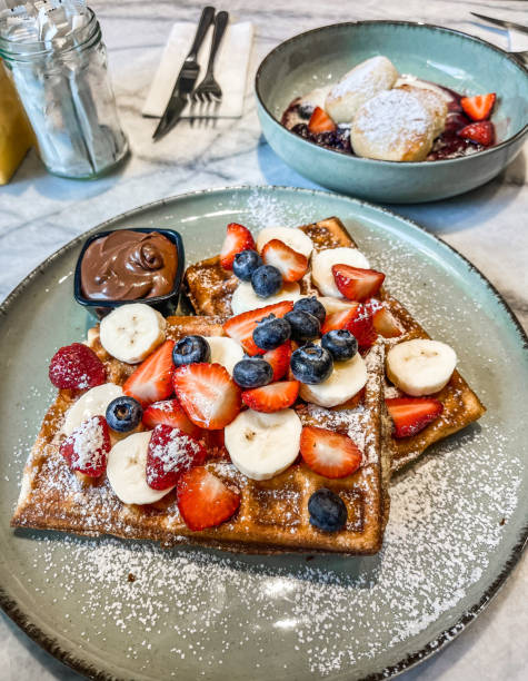 istock Golden Belgian Waffles with Fresh Berries and Maple Syrup. 2201034196