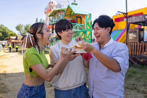 istock Happy Moments Between Friends at the Funfair 2201035282