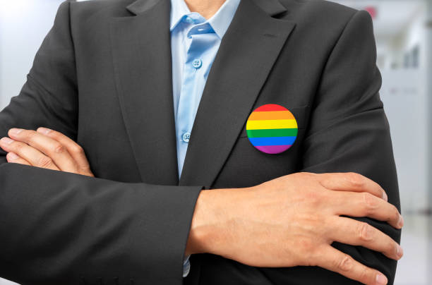istock LGBT flag pin attached to business man suit 2201035935