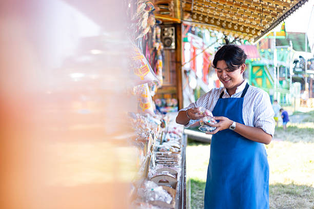 istock Male Worker Counting Stock at the Confectionary Stall 2201036330