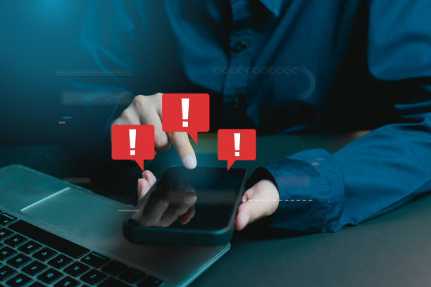 istock Alert Notifications on Smartphone with Businessman in Blue Shirt 2201038678