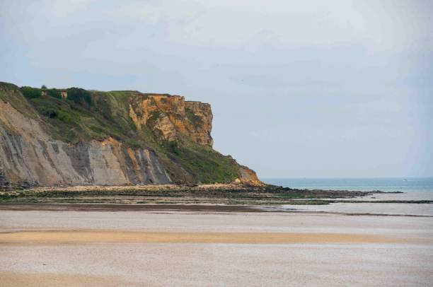 istock Cliffs at Mulberry Harbour at Arromanches and Omaha Beach, Normandy, France 2201040795