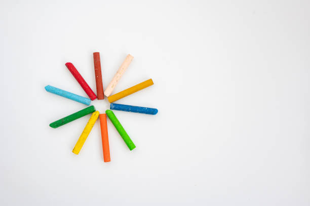 istock Colorful chalk circle on white paper background. Crayola Crayon Day 2201041274