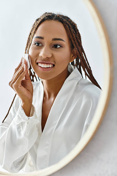 istock Caring for skin at home while enjoying a moment of self reflection in the mirror 2201043954