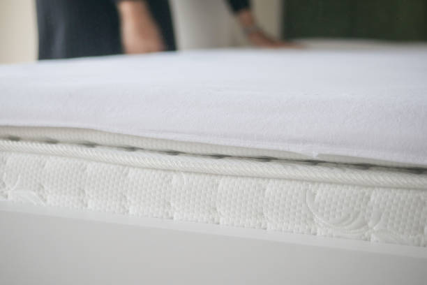 istock Bed with white orthopedic mattress in a room. 2201044800