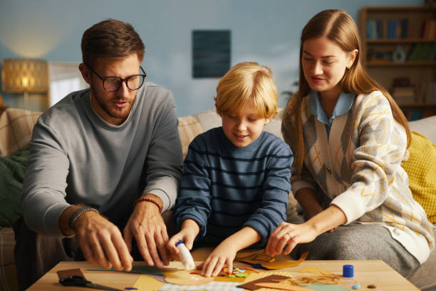 istock Family Spending Creative Time Engaging in Crafts Together 2201045319