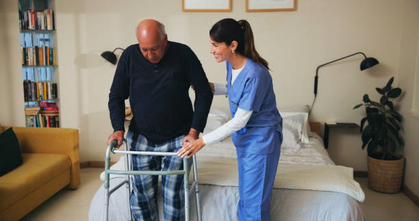 istock Walking, help and nurse with senior man for rehabilitation, healing or support at retirement home. Medical, physical therapy and caregiver with elderly person with disability for mobility recovery 2201047241
