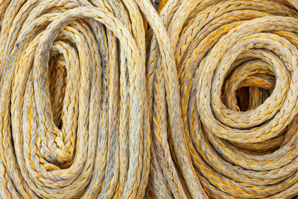 istock Twisted old synthetic ship's mooring rope, close-up. 2201047885