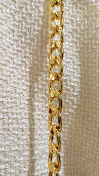 istock Clothing accessory. yellow gold chain 2201047995