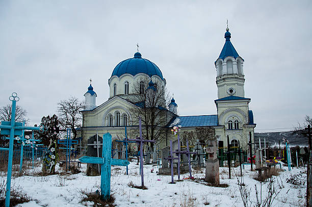 istock Cemetery with a church in the background. 2201049787