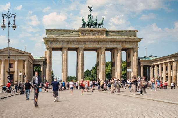 istock motion blurred crowd ot tourists in front of Brandenburg Gate 2201051927