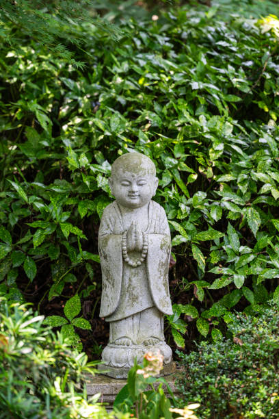 istock A Serene Statue in a Chinese Garden 2201052904