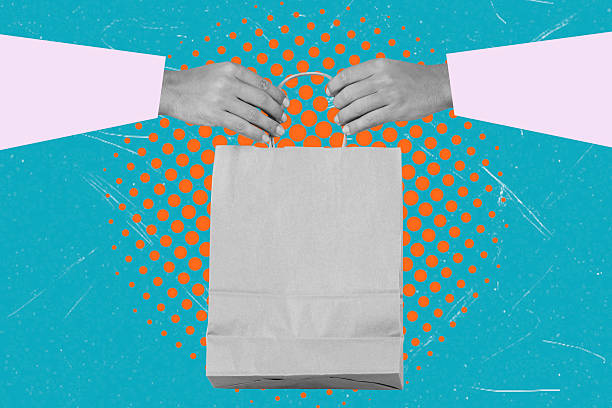istock Modern art collage image of hands holding a paper bag on a blue background. 2201053978