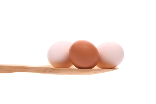 Three newly laid brown eggs, representing natural and healthy food.