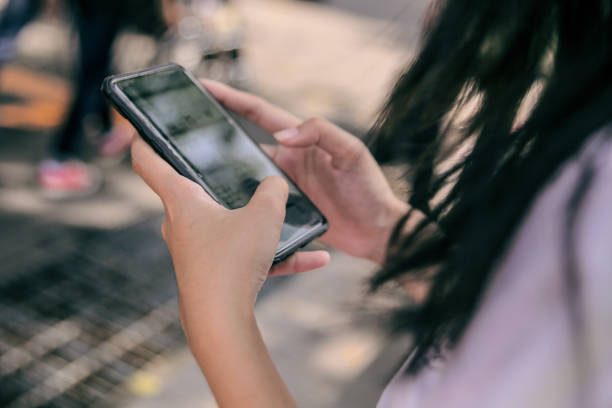 istock woman texting on mobile phone 2201055343
