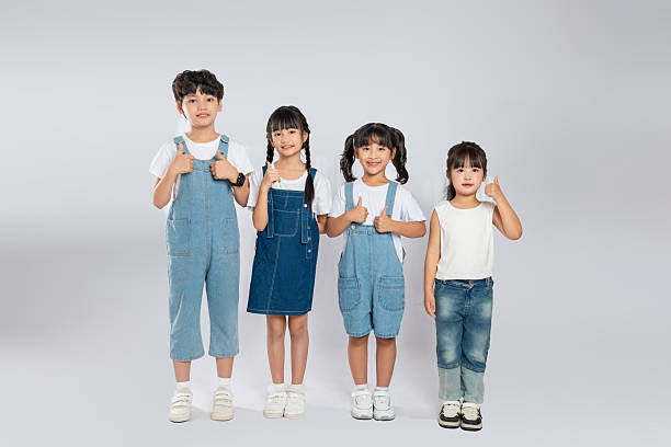 istock group image of cute asian kids posing on white background 2201061388