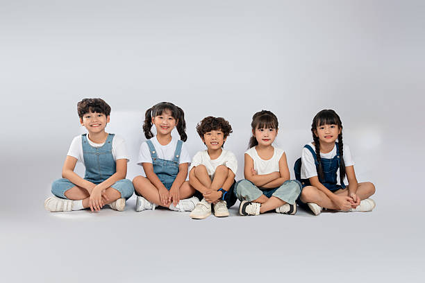istock group image of cute asian kids posing on white background 2201061418