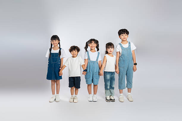 istock group image of cute asian kids posing on white background 2201061537