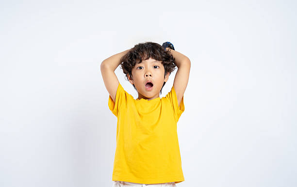 istock Portrait of beautiful Asian boy posing on white background, child 2201065748