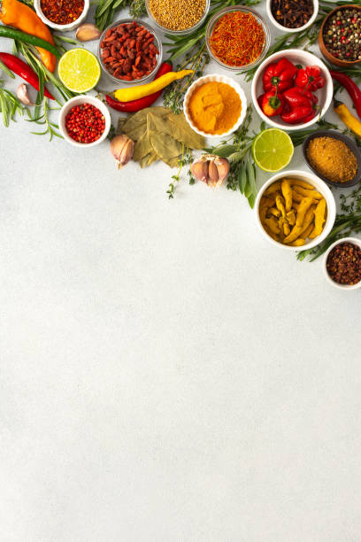 istock Colorful herbs and spices scattered across a gray surface, ideal for creating authentic and flavorful dishes, top view and copy space 2201075111