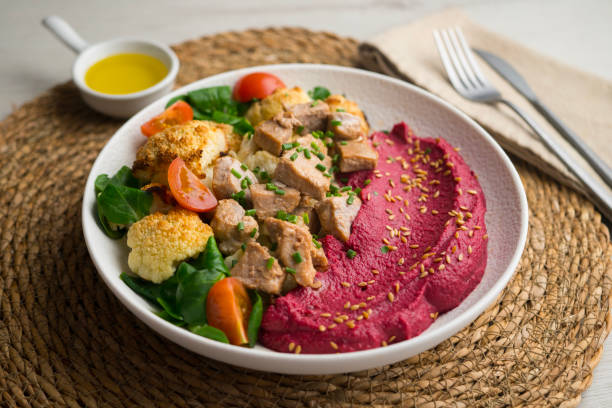istock Complete dish with pork, beetroot cream and roasted cauliflower. 2201076904