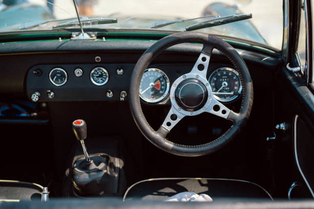 istock Interior of a Vintage Car Featuring Steering Wheel and Dashboard 2201078144