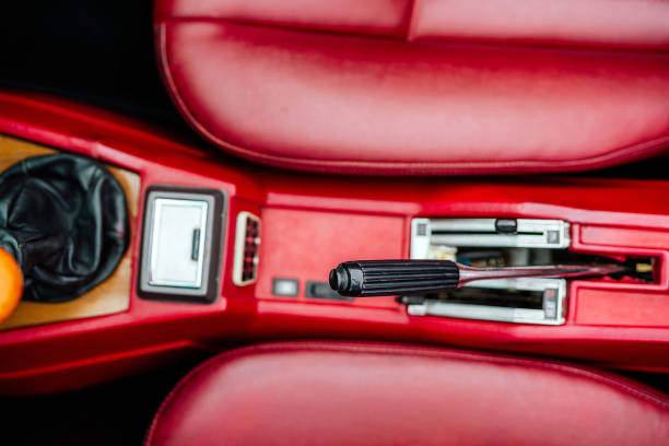 istock Red Car Interior Featuring Handbrake and Gear Stick in Close-Up View 2201078153