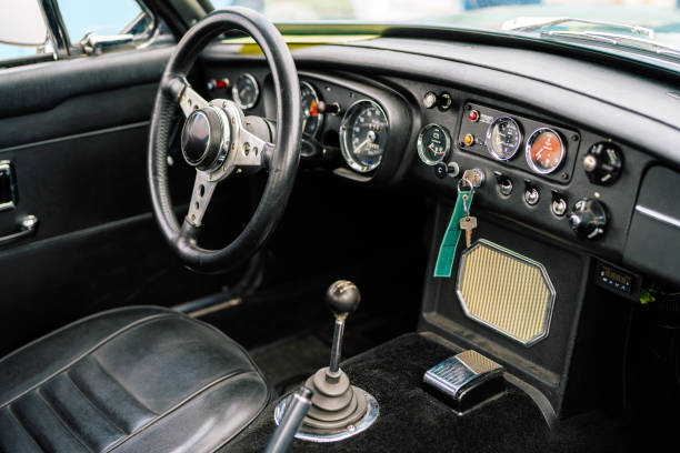istock Interior of a Classic Car Highlighting Dashboard and Steering Design 2201078163
