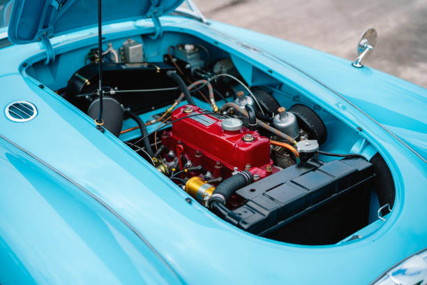 Bright Blue Classic Car with an Exposed Red Engine Close-Up View