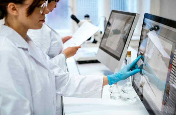 istock Focused Female Student Researching in Modern University Laboratory 2201085806