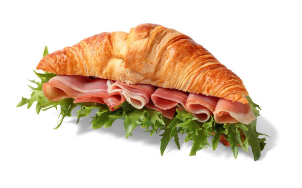 istock croissant sandwich with ham and lettuce on white 2201089078