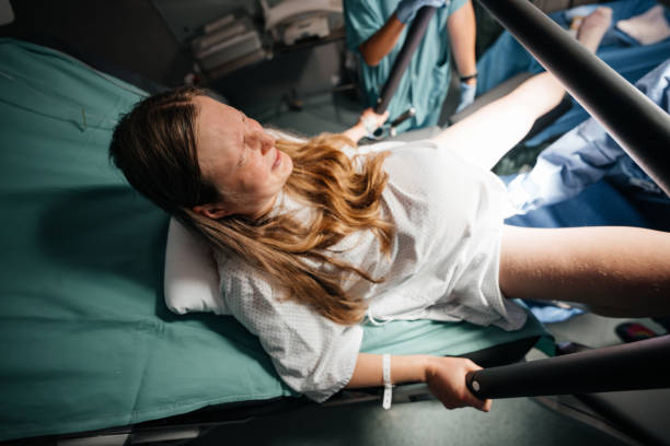 istock Woman in Active Labor Pushing During Childbirth in Hospital 2201091918