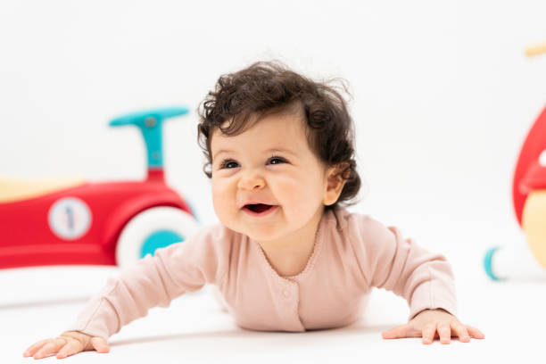 istock Cute Portrait of a Crawling Baby 2201092474
