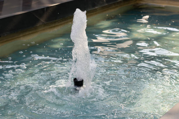 istock A small fountain is shooting water into a pool 2201092780
