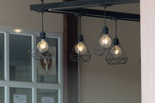 istock A row of four lights hanging from a ceiling 2201093047