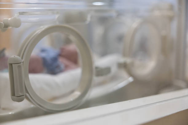 istock Blurred Premature or preterm baby is in a hospital incubator. 2201093121