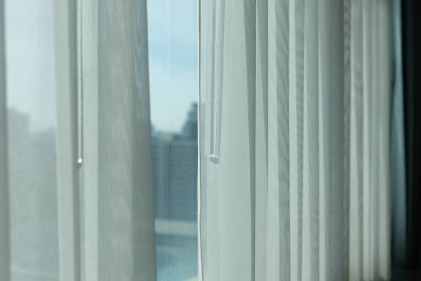 istock The curtains are white and the window is open 2201093125