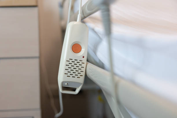 istock emergency button in hospital. press button hanging near patient bed for the Nurse call system in hospital. Clinic, healthcare, medical electronic communication equipment. First aid of medical staff. 2201093348
