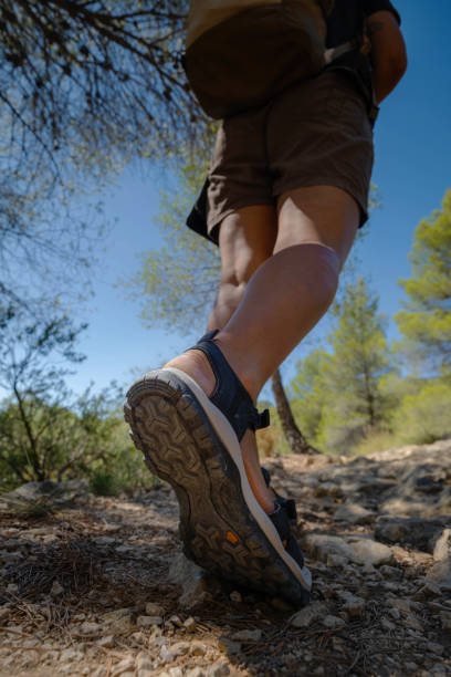 istock Walking Girl Shoe Sole mountain path 2201098030