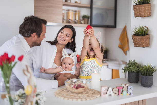 istock Happy woman surrounded by family for Easter 2201098456