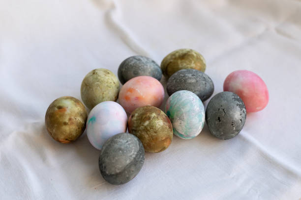 istock Easter eggs painted in green-brown colors and Karkade tea, background 2201100153